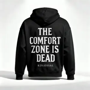 Black Kolossal hoodie back view with "The Comfort Zone Is Dead" motivational print