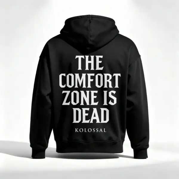 Black Kolossal hoodie back view with "The Comfort Zone Is Dead" motivational print