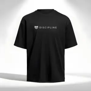 Black Kolossal Discipline loose fit gym t-shirt with minimalist white Discipline chest print on a clean light studio background. Premium oversized athletic shirt designed for hybrid training, comfort and minimalist streetwear aesthetics.