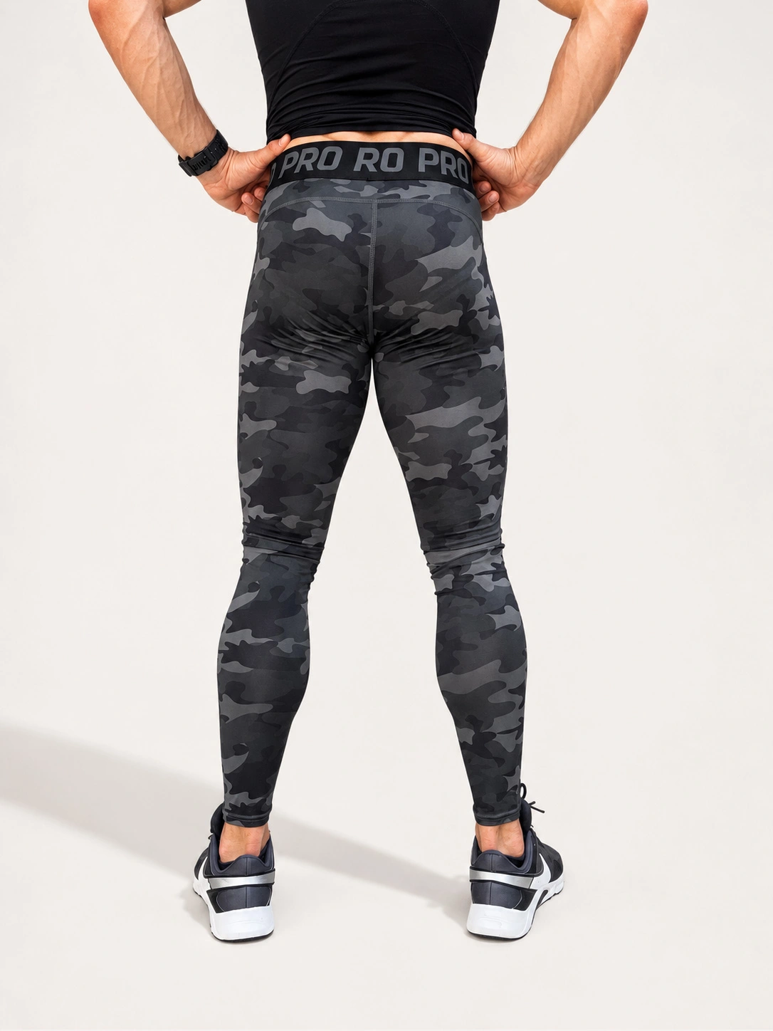 Back view of the Kolossal Tactical Compression Leggings for men in dark camo.