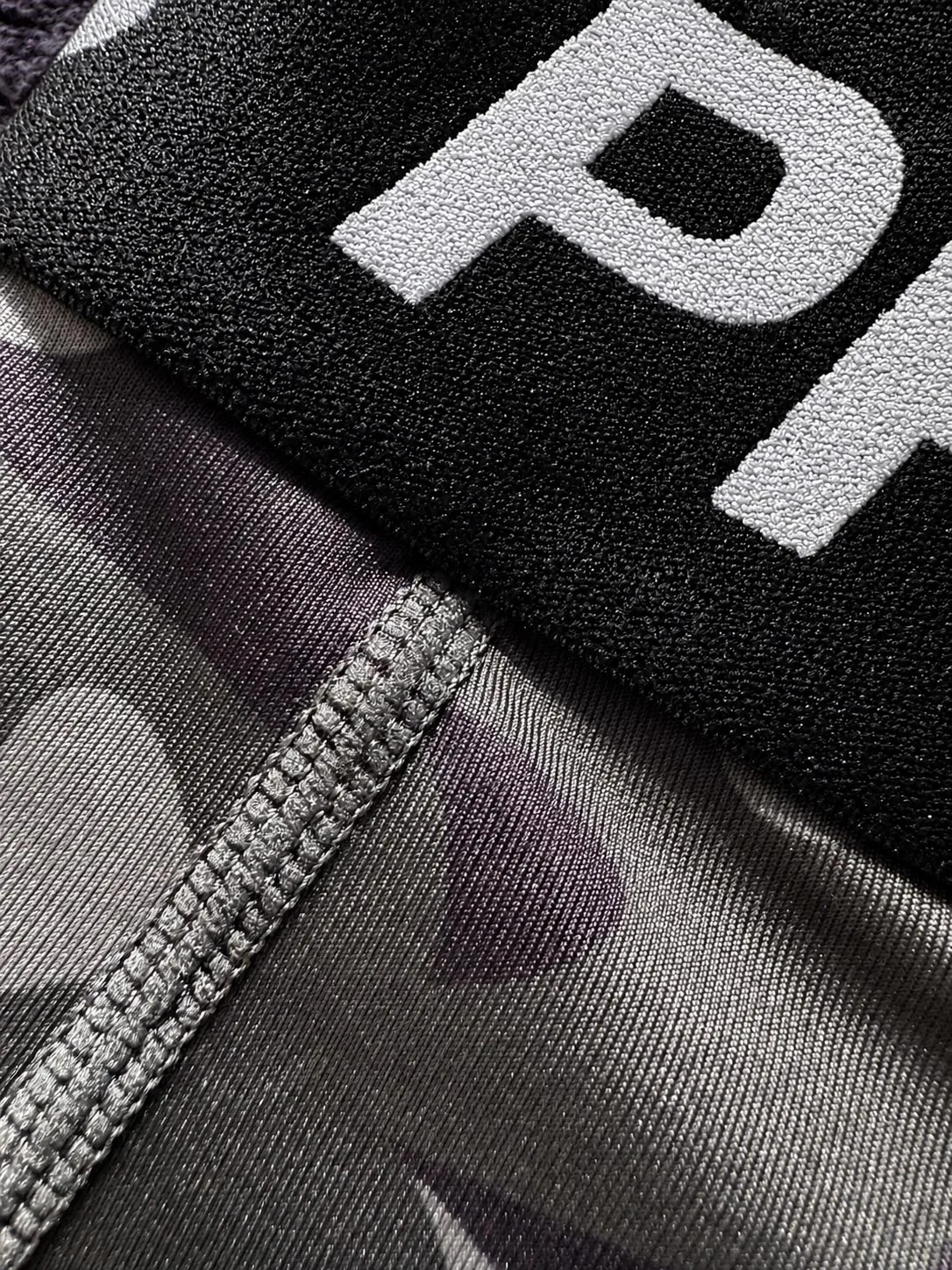 Close-up of the Kolossal Tactical Compression Leggings showcasing the flatlock stitching, premium stretch fabric and elastic waistband for enhanced durability and comfort.