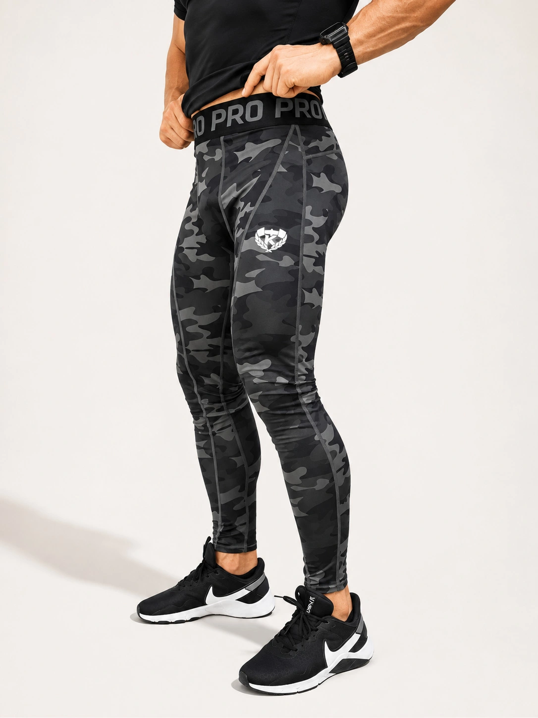 Side view of the Kolossal Tactical Compression Leggings in dark camouflage.