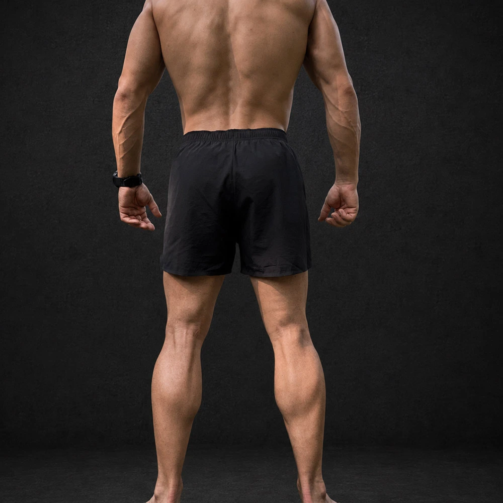 Vista trasera del short de entrenamiento KOLOSSAL Core negro para hombre